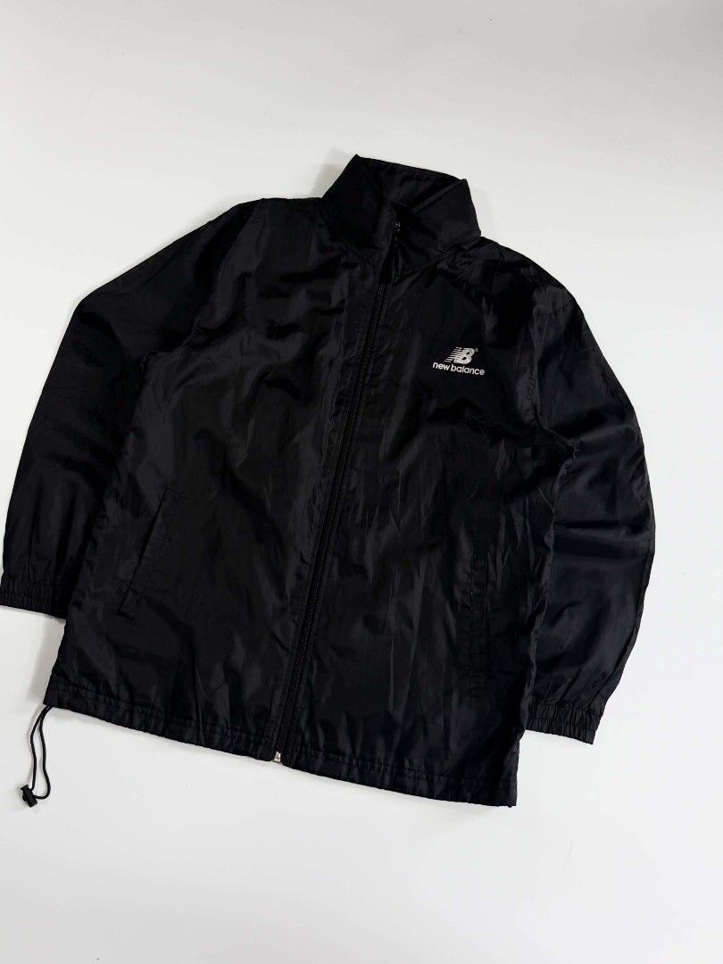 New Balance Windbreaker (Category: Coats, Jackets and Outerwear) located in Valenzuela. Submitted by veriez_gems (Listing ID 1468626829, Image 2). Description: Gear up with classic, lightweight New Balance performance—the perfect, versatile layer for your active lifestyle! Brand: New Balance Style: Men's Full-Zip Athletic Track Jacket / Windbreaker Color: Classic Solid Black Visible Details & Accuracy: Signature New Balance "NB" logo and wordmark