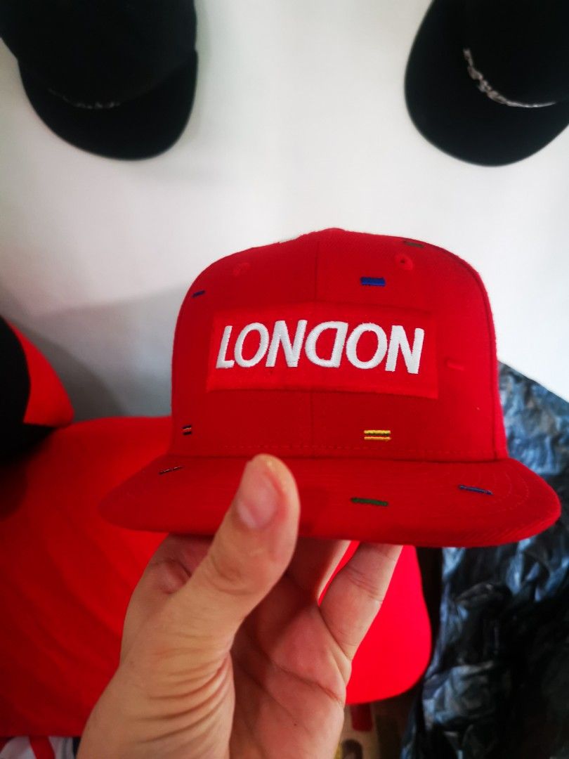 New Era 9FIFTY London Red Snapback Cap (Category: Caps & Hats) located in Pasay City. Submitted by wizemindz138970 (Listing ID 1468590715, Image 1). Description: - Brand: New Era 9FIFTY - Style: Snapback cap (Size: Small to Medium) - Color/Pattern: Red with multicolored dash patterns - Design: Embroidered London box logo on the front - Material: 100% wool - Closure: Adjustable snapback with New Era branding - Condition: Brand new with clean inter