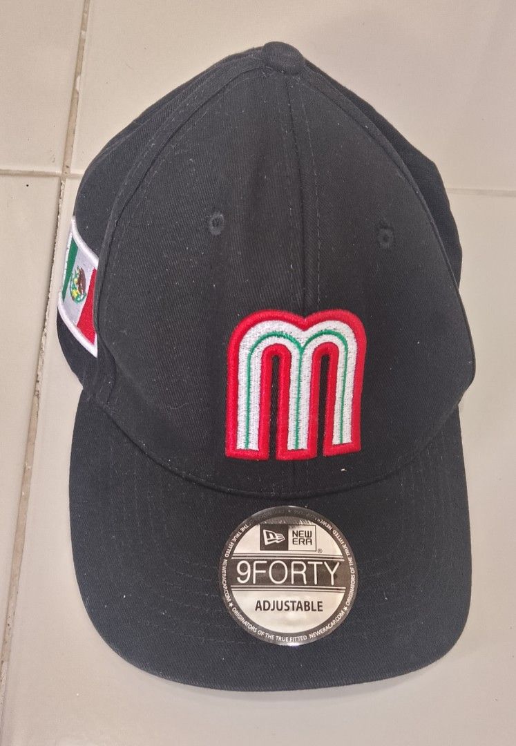 New Era 9FORTY Mexico Baseball Cap Black (Category: Caps & Hats) located in Caloocan City. Submitted by tamonchi (Listing ID 1468649949, Image 1). Description: - Authentic New Era 9FORTY adjustable cap in black - Embroidered Mexico 'M' logo on the front with a side Mexican flag patch - Classic curved brim with original sticker still attached - Adjustable snapback closure for a customizable fit - Clean interior lining with official branded taping 