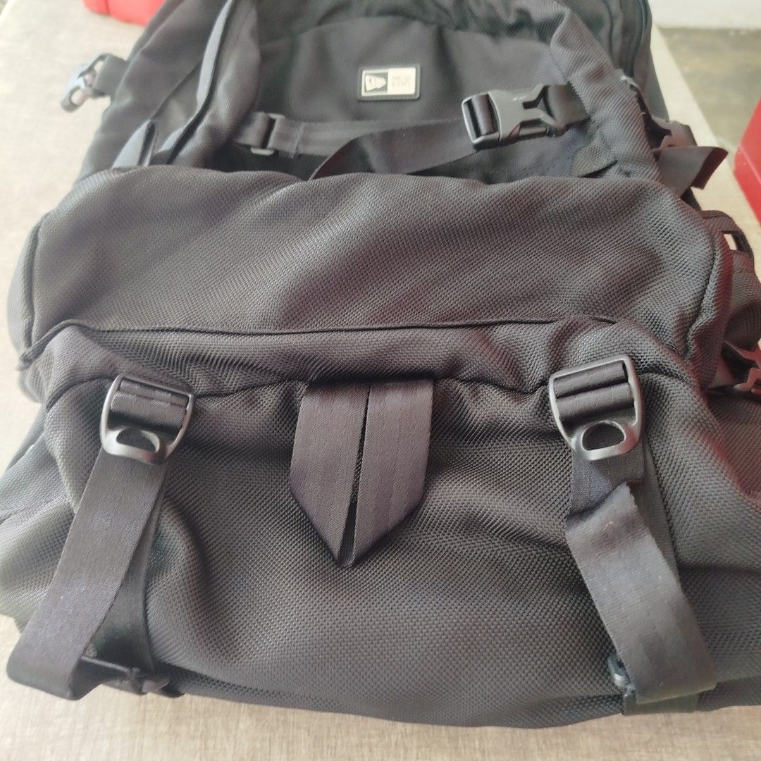 New Era Black Tactical Backpack (Category: Backpacks) located in Davao. Submitted by vernoneighty4 (Listing ID 1468544269, Image 3). Description: - Brand: New Era - Color: Black - Material: Sturdy canvas - Comfort: Mesh padded back panel and shoulder straps - Storage: Multiple zip compartments, utility straps, and buckles - Condition: Clean inside and out - Ideal for: School, work, or travel.