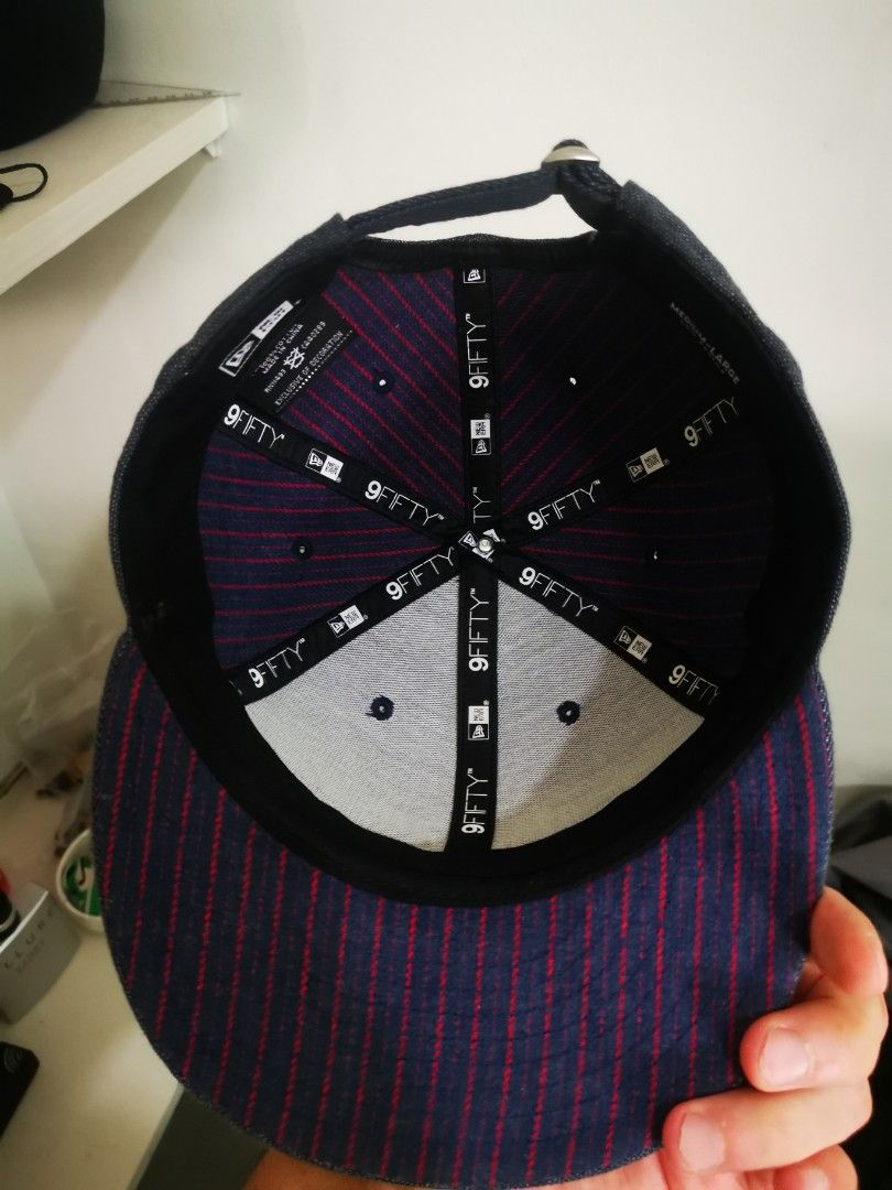 New Era Originator 9FIFTY Low Profile Cap (Category: Caps & Hats) located in Pasay City. Submitted by wizemindz138970 (Listing ID 1468591362, Image 2). Description: - Brand: New Era 9FIFTY Low Profile Hat - Material/Texture: Dark denim - Embroidery: Red 'Originator' script on front, classic red New Era flag on left side - Interior: Navy and red striped lining with 9FIFTY taped seams - Fit: Adjustable strap closure at the back (Size: Medium-Large)