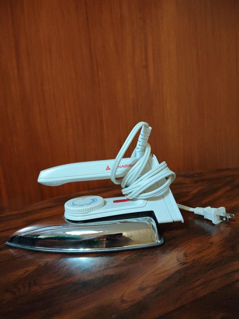 NEW Iron / Plantsa (Category: Irons & Steamers) located in Manila. Submitted by bokkymanokky (Listing ID 1468605569, Image 1). Description: USED ONLY ONCE OR TWICE. no box. LEGIT NEW! - Color/Finish: White body with a shiny chrome soleplate - Features: Adjustable temperature control dial for various fabric - Cord: Long white power cord wrapped neatly around the handle - Plug: Standard two-prong plug - Condition: Clean and 100% ready to use.