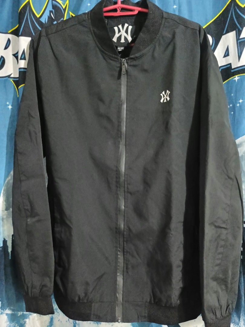 New York Yankees MLB Black Bomber Jacket (Category: Coats, Jackets and Outerwear) located in Manila. Submitted by tonycess16 (Listing ID 1468525042, Image 1). Description: - Color: Classic solid black - Team: New York Yankees (small embroidered chest logo) - Closure: Full zip front - Details: Ribbed collar, cuffs, and hem to block the wind - Fit: Lightweight, perfect for casual streetwear.