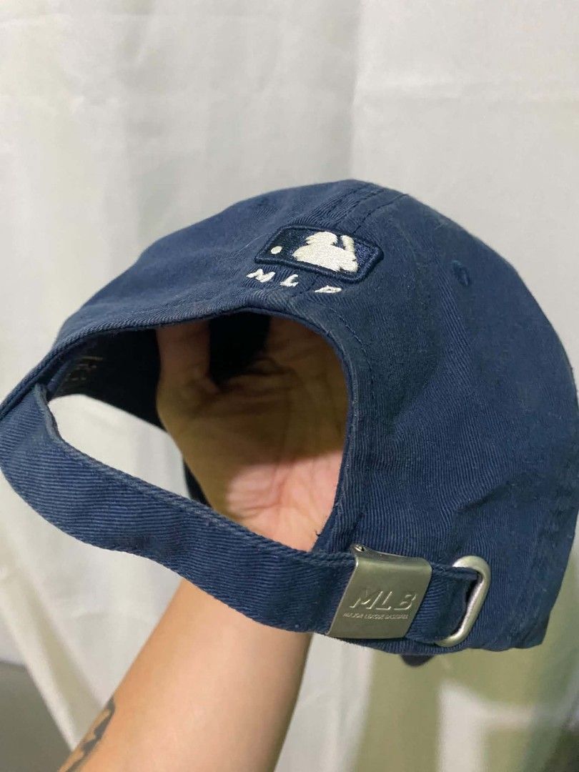 New York Yankees MLB Navy Blue Dad Hat Cap (Category: Caps & Hats) located in Quezon City. Submitted by elihur.tuazon (Listing ID 1468685934, Image 3). Description: - Authentic New York Yankees dad hat in classic navy blue - Features white embroidered NY logo on the front and MLB batterman logo at the back - Adjustable strap closure with an MLB-branded metal slider buckle - Designed with branded inner taping and internal tags - Comfortable, casua