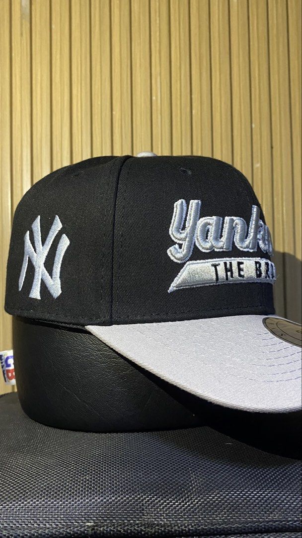 New York Yankees The Bronx Snapback Cap (Category: Caps & Hats) located in Manila. Submitted by _kyndzgrt (Listing ID 1468682968, Image 1). Description: - Color: Black and grey - Design: Yankees text embroidery on the front with 'The Bronx' detail - Branding: Classic white NY logo stitched on the side - Brim: Grey flat brim complete with silver Snapback Classics sticker - Fit: Adjustable snapback closure at the back - Style: Clean and classic str