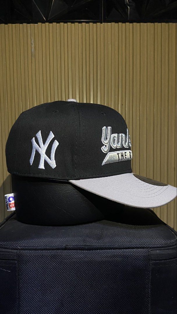 New York Yankees The Bronx Snapback Cap (Category: Caps & Hats) located in Manila. Submitted by _kyndzgrt (Listing ID 1468682968, Image 2). Description: - Color: Black and grey - Design: Yankees text embroidery on the front with 'The Bronx' detail - Branding: Classic white NY logo stitched on the side - Brim: Grey flat brim complete with silver Snapback Classics sticker - Fit: Adjustable snapback closure at the back - Style: Clean and classic str