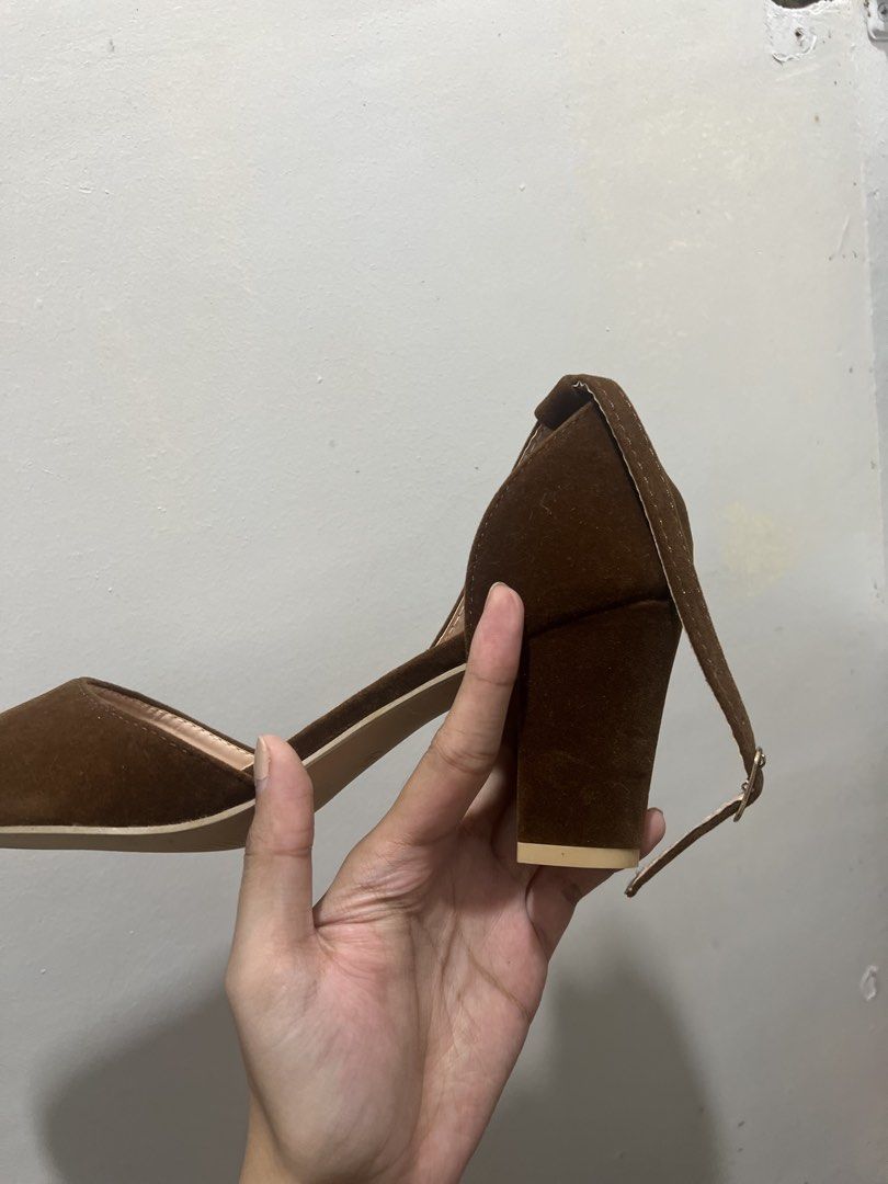 Size 8 NICELY Brown Suede Pointed Toe Block Heel Size 39 (Category: Heels) located in Manila. Submitted by 34samf (Listing ID 1468599488, Image 2). Description: - Brand: NICELY - Size: 39 - Material: Brown suede - Style: Pointed toe with ankle strap and gold-tone buckle - Heel: Stable chunky block heel - Condition: Clean soles with zero wear - Versatile neutral earth tone Location: Manila📍.