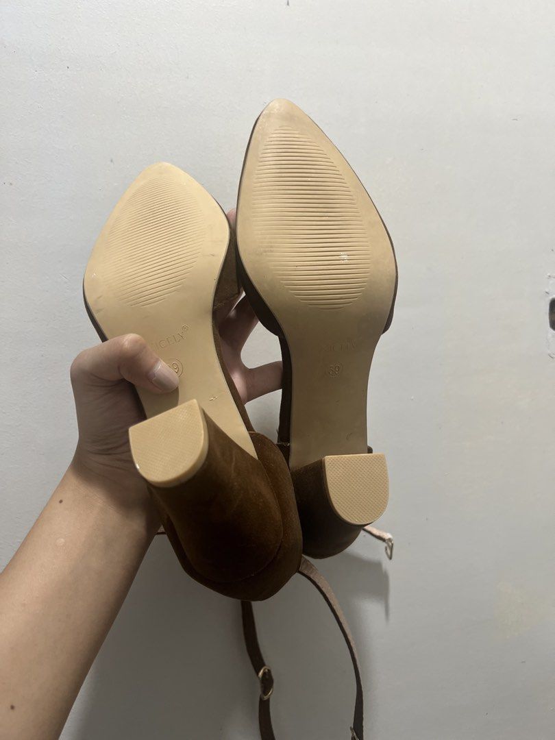 Size 8 NICELY Brown Suede Pointed Toe Block Heel Size 39 (Category: Heels) located in Manila. Submitted by 34samf (Listing ID 1468599488, Image 3). Description: - Brand: NICELY - Size: 39 - Material: Brown suede - Style: Pointed toe with ankle strap and gold-tone buckle - Heel: Stable chunky block heel - Condition: Clean soles with zero wear - Versatile neutral earth tone Location: Manila📍.