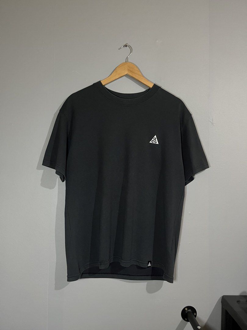 Nike ACG Black T-Shirt (Category: Tshirts & Polo Shirts ) located in Butuan. Submitted by thriftheadsofficial (Listing ID 1468505128, Image 1). Description: - Brand: Nike ACG - Color: Black - Size: Medium - Details: Embroidered triangle logo on chest, small ACG hem tag, crew neck collar - Fit & Use: Comfortable fit, ideal for daily wear, hiking, or streetwear layering - Origin: Made in China.