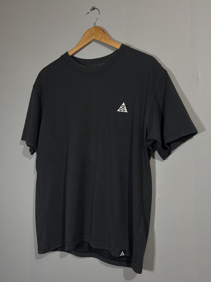 Nike ACG Black T-Shirt (Category: Tshirts & Polo Shirts ) located in Butuan. Submitted by thriftheadsofficial (Listing ID 1468505128, Image 2). Description: - Brand: Nike ACG - Color: Black - Size: Medium - Details: Embroidered triangle logo on chest, small ACG hem tag, crew neck collar - Fit & Use: Comfortable fit, ideal for daily wear, hiking, or streetwear layering - Origin: Made in China.
