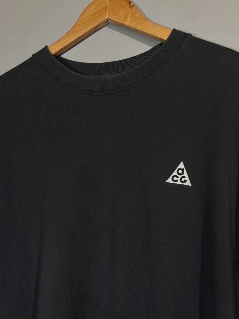 Nike ACG Black T-Shirt (Category: Tshirts & Polo Shirts ) located in Butuan. Submitted by thriftheadsofficial (Listing ID 1468505128, Image 3). Description: - Brand: Nike ACG - Color: Black - Size: Medium - Details: Embroidered triangle logo on chest, small ACG hem tag, crew neck collar - Fit & Use: Comfortable fit, ideal for daily wear, hiking, or streetwear layering - Origin: Made in China.