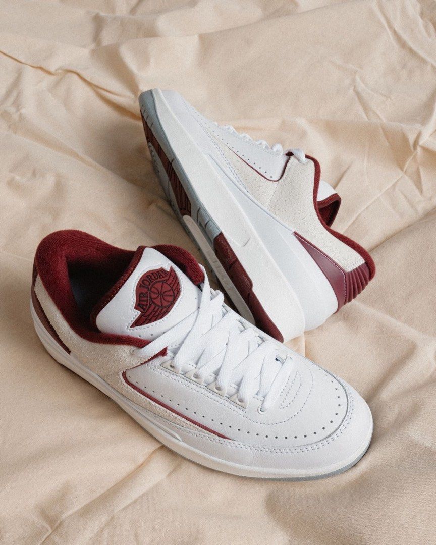 Nike Air Jordan 2 Retro Low (Category: Sneakers) located in Manila. Submitted by themb (Listing ID 1468529626, Image 2). Description: - Model: Air Jordan 2 Retro Low - Colorway: White and Dark Red - Details: Suede side paneling, perforated leather toe box, embroidered wings logo on tongue - Condition: Good, with minor dirt marks on midsoles from previous wear - Inclusions: Comes with original box - Perfect for daily wear or collection.