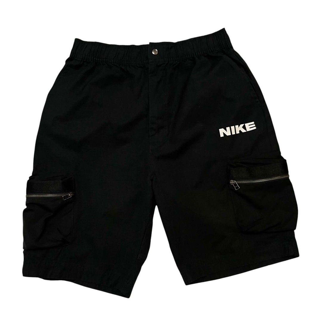 Nike Black Cargo Shorts with Side Pockets (Category: Shorts) located in Cagayan de Oro. Submitted by lootfindzzzz (Listing ID 1468620761, Image 1). Description: - Authentic Nike black cargo shorts - Comfortable elastic waistband with metal snap closure - Two side cargo pockets with secure zippered compartments - Bold white Nike branding printed on the left leg - Made from durable, breathable cotton-blend fabric - Ideal for warm weather and everyd