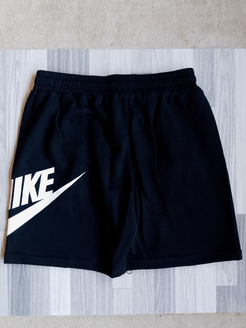 Nike Black Shorts with Large Logo (Category: Shorts) located in Batangas. Submitted by rafstaywitstaff_11 (Listing ID 1468585291, Image 1). Description: - Color: Classic Black - Material: Soft, breathable fabric for ultimate comfort - Design: Bold white Nike text logo on one side and swoosh logo on the other - Fit: Secure elastic waistband with adjustable drawstring - Features: Two convenient side pockets - Best For: Gym workouts, sports, or casu