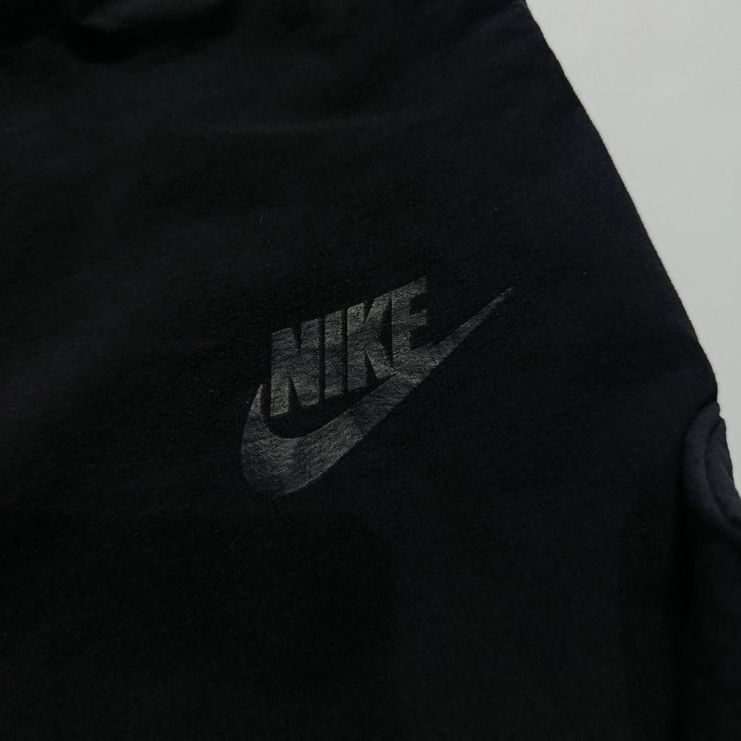 Nike Black Straight-Leg Woven Pants (Category: Joggers) located in Taytay. Submitted by hoodgrail.vtg (Listing ID 1468621225, Image 3). Description: • Excellent condition - Lightly used • Lightweight nylon-stretch fabric, subtle printed Swoosh logo and zippered side pocket • Size on tag: XL — best fits 28–32 • Measurements: 14.5 x 38.5 in • Leg opening: 5 in • Color rate: 9.5/10 • Issue: None.