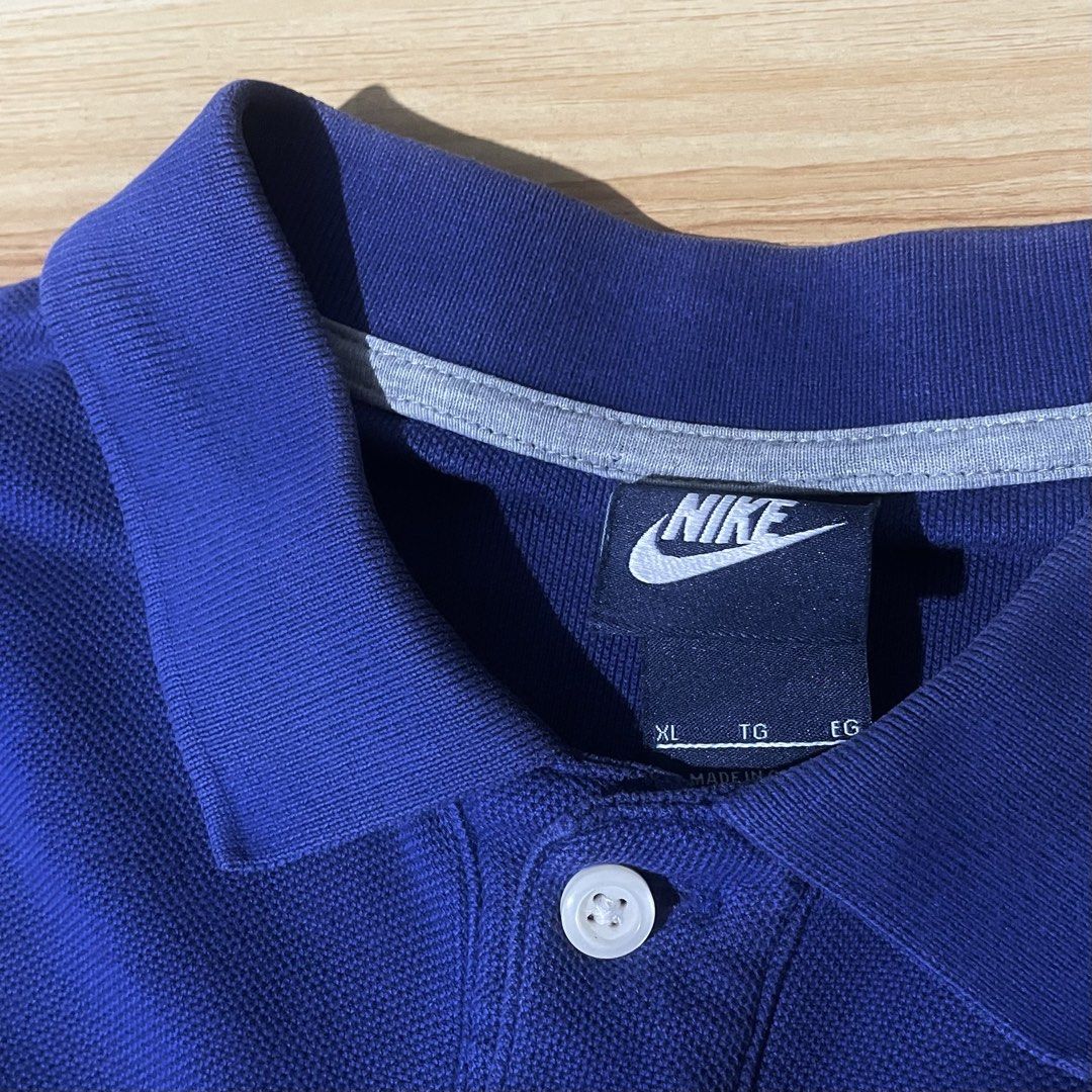 Nike blue polo (Category: Activewear) located in Manila. Submitted by kidd21vergil (Listing ID 1468630467, Image 2). Description: Nike polo blue Good condition W22 L27 9/10 color rate Issue. Minimal Fold line pinholes.