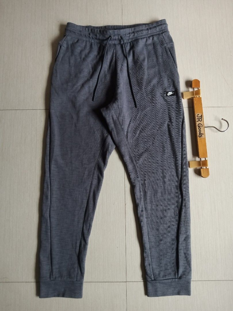Nike box logo Grey Jogger (Category: Joggers) located in Tanay. Submitted by jrgoods (Listing ID 1468513385, Image 2). Description: Nlke box logo Large Waistline 32-34 length 38.5 Excellent to new condition 780+ship Tanay Rizal location Shipping Nationwide - Material: Comfortable cotton blend - Fit & Comfort: Elastic drawstring waistband and ribbed cuffs - Details: Small black Nike logo patch near the pocket - Storage: Convenient zippered pocket 