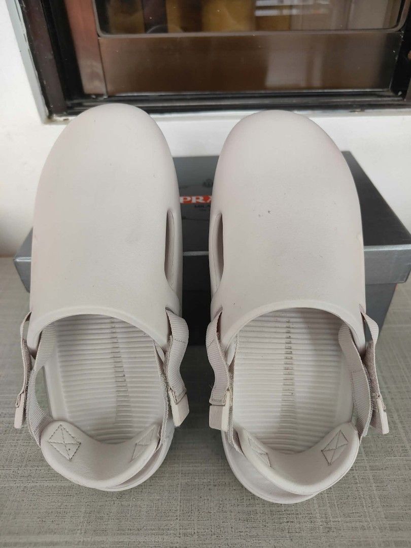 Nike Calm Slide Sandals Beige (Category: Slippers & Slides) located in Plaridel. Submitted by jkauthentics (Listing ID 1468536924, Image 2). Description: Used once❤️ - Brand: Nike Calm Slides - Color: Beige - Style: Slip-on with adjustable back strap and side cut-outs - Features: Embossed Nike swoosh, ribbed footbed, and textured sole for grip - Condition: Like new with slight scuffs on the soles from trial only.