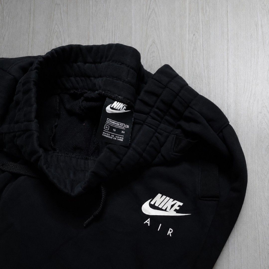 Nike Cargo Jogger Pants (Category: Joggers) located in Taguig. Submitted by althriftdailyloots94 (Listing ID 1468604094, Image 2). Description: - Brand: Nike Air - Style: Fleece joggers / sweatpants - Color: Black with contrasting white ripstop cargo pocket - Size: XL Youth Fit to small to medium adult 28-32 waist 38 length - Features: Elastic waistband with drawstring, ribbed ankle cuffs, Nike Air logo on left thigh - Condition: Brand new / Exce