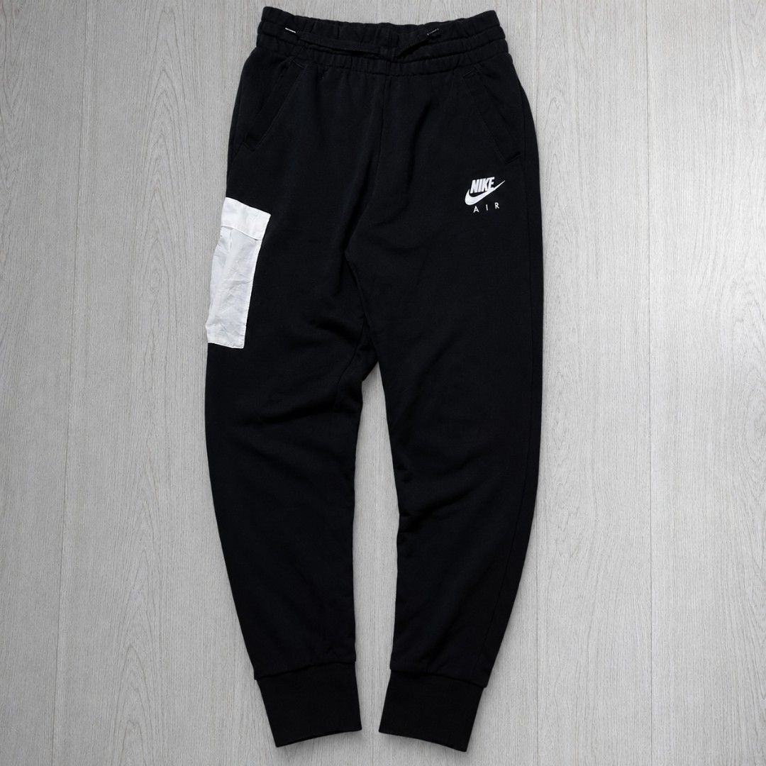 Nike Cargo Jogger Pants (Category: Joggers) located in Taguig. Submitted by althriftdailyloots94 (Listing ID 1468604094, Image 1). Description: - Brand: Nike Air - Style: Fleece joggers / sweatpants - Color: Black with contrasting white ripstop cargo pocket - Size: XL Youth Fit to small to medium adult 28-32 waist 38 length - Features: Elastic waistband with drawstring, ribbed ankle cuffs, Nike Air logo on left thigh - Condition: Brand new / Exce