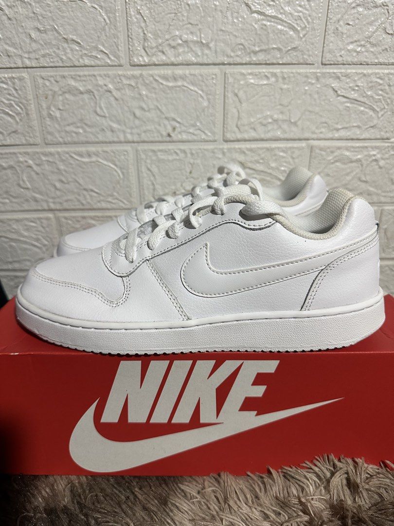 Nike Ebernon Low White Sneakers Size US 7 (Category: Sneakers) located in Manila. Submitted by bizfits_ (Listing ID 1468687582, Image 3). Description: - Brand: Nike Ebernon Low - Color: Triple White - Size: US 7 / UK 6 / EUR 40 / CM 25 - Condition: Brand new, never worn, crisp condition - Features: Classic court style, textured leather upper, clean white rubber sole - Inclusion: Comes with original red Nike shoebox.