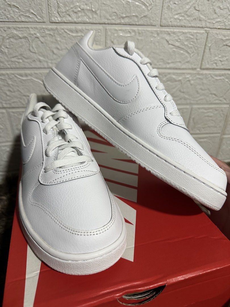 Nike Ebernon Low White Sneakers Size US 7 (Category: Sneakers) located in Manila. Submitted by bizfits_ (Listing ID 1468687582, Image 2). Description: - Brand: Nike Ebernon Low - Color: Triple White - Size: US 7 / UK 6 / EUR 40 / CM 25 - Condition: Brand new, never worn, crisp condition - Features: Classic court style, textured leather upper, clean white rubber sole - Inclusion: Comes with original red Nike shoebox.