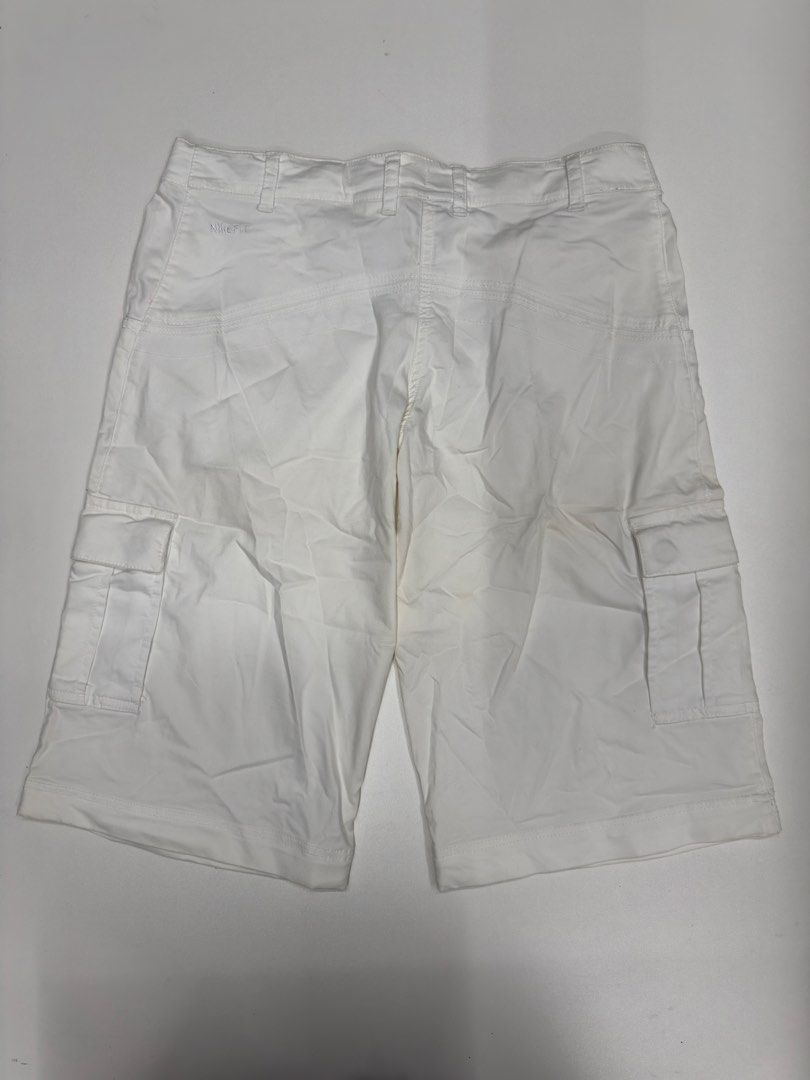 Nike Fit White Cargo Shorts Size 6 (Category: Shorts) located in Bustos. Submitted by thenlnclot60500 (Listing ID 1468527860, Image 2). Description: - Brand: Nike - Style: Fit cargo shorts - Color: White - Size: 6 / 34 on tag - Features: Multiple utility pockets, button closure, zipper fly - Details: Embroidered logo on the back, small swoosh on front leg - Condition: Clean fabric - Perfect for: Casual wear or outdoor activities.