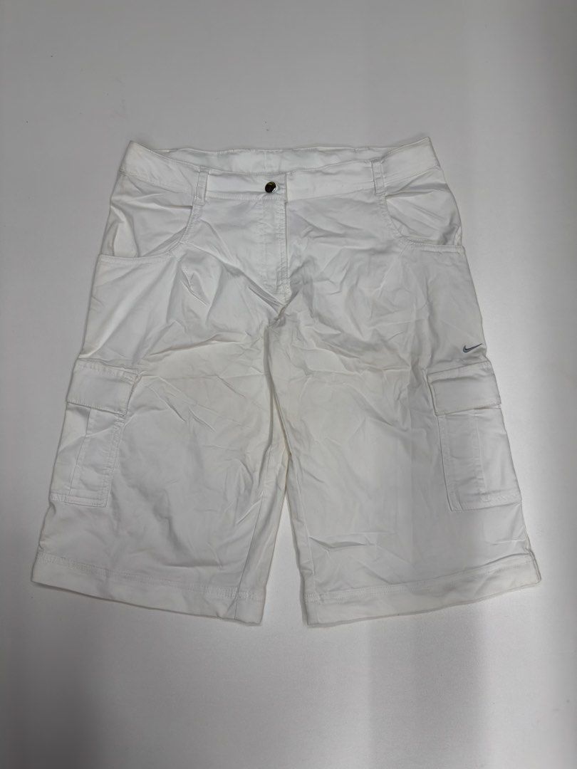 Nike Fit White Cargo Shorts Size 6 (Category: Shorts) located in Bustos. Submitted by thenlnclot60500 (Listing ID 1468527860, Image 1). Description: - Brand: Nike - Style: Fit cargo shorts - Color: White - Size: 6 / 34 on tag - Features: Multiple utility pockets, button closure, zipper fly - Details: Embroidered logo on the back, small swoosh on front leg - Condition: Clean fabric - Perfect for: Casual wear or outdoor activities.
