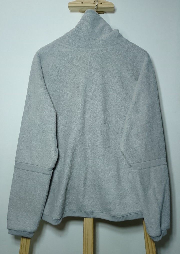Nike Gray Fleece High Neck Sweatshirt (Category: Coats, Jackets and Outerwear) located in Manila. Submitted by patrickjos06722 (Listing ID 1468673220, Image 2). Description: - Brand: Nike - Color: Gray - Material: Warm fleece - Neckline: High cowl neck with adjustable drawstrings - Features: Two front pockets, raglan sleeves with ribbed panels, subtle embroidered Swoosh on left cuff - Measurements (laid flat): Chest width ~23", Length ~24.5", Sle