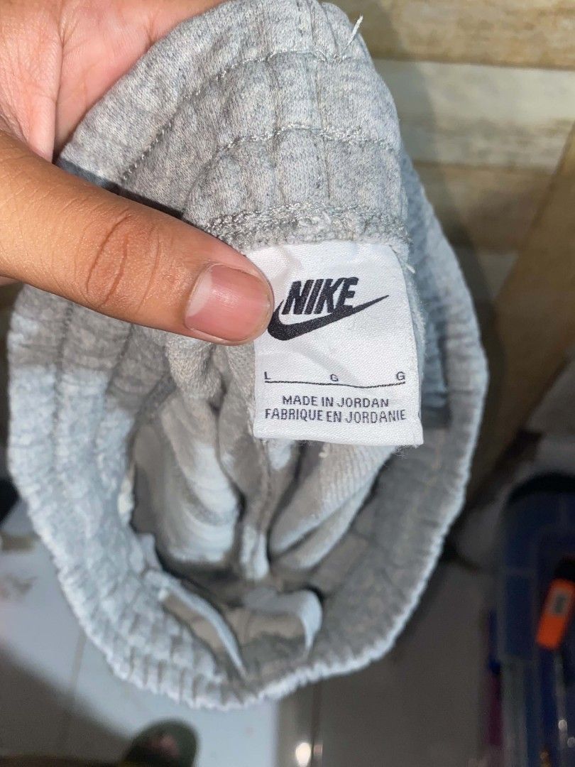 Nike Gray Sweatshorts (Category: Shorts) located in Maasin. Submitted by trippythirftyyy (Listing ID 1468643410, Image 3). Description: - Brand: Nike - Item: Sweatshorts - Color: Gray - Size: Large (youth) small (adult) - Style Code: FD3015-063 - Origin: Made in Jordan - Material: Soft cotton blend - Features: Embroidered Nike logo on left leg, comfortable elastic waistband with adjustable drawstring - Condition: Great for lounging or casual wear