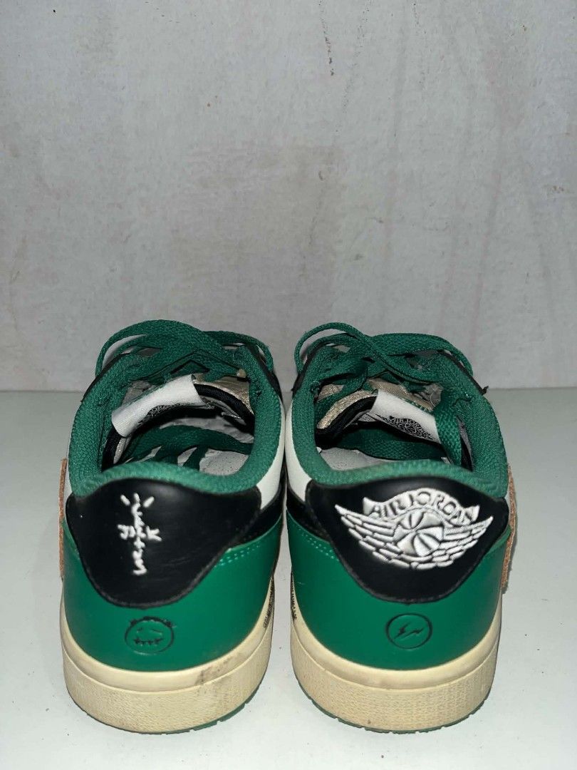 Nike Jordan 1 Low Travis Scott Green (Category: Sneakers) located in Manila. Submitted by wildwolf.e866c3 (Listing ID 1468620795, Image 3). Description: - Brand/Model: Nike Air Jordan 1 Low - Size: EUR 38.5 - Colorway: White leather, black overlays, green accents, cream reverse swoosh, green laces - Special Details: Cactus Jack embroidery on one heel, Jordan wings and Fragment logo on the other - Condition: Shows wear on midsoles and soles with c
