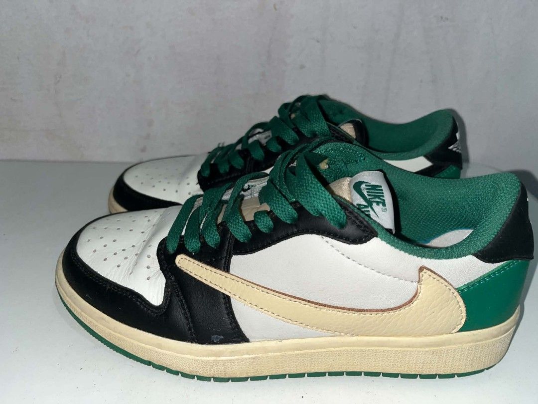 Nike Jordan 1 Low Travis Scott Green (Category: Sneakers) located in Manila. Submitted by wildwolf.e866c3 (Listing ID 1468620795, Image 1). Description: - Brand/Model: Nike Air Jordan 1 Low - Size: EUR 38.5 - Colorway: White leather, black overlays, green accents, cream reverse swoosh, green laces - Special Details: Cactus Jack embroidery on one heel, Jordan wings and Fragment logo on the other - Condition: Shows wear on midsoles and soles with c