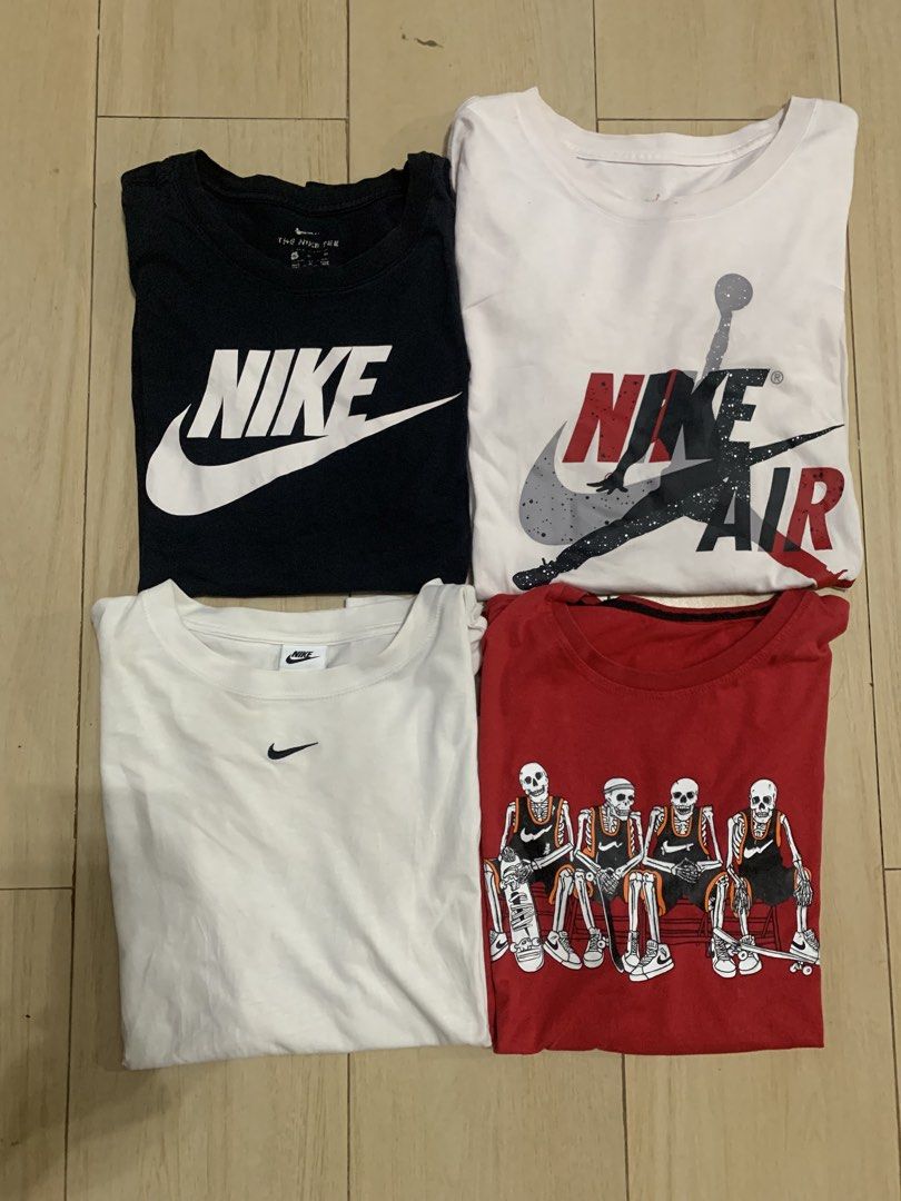 Nike Jordan Graphic T-Shirts Bundle 4 Pieces (Category: Tshirts & Polo Shirts ) located in Manila. Submitted by thrifty111 (Listing ID 1468620869, Image 1). Description: - Set of 4 authentic Nike and Jordan t-shirts for daily rotation - Includes: Black Nike swoosh tee, white Jordan Air graphic tee, white minimalist swoosh tee, and red skeleton basketball tee - Style: Standard crew neck, short sleeve, casual streetwear and athletic fit - Condition