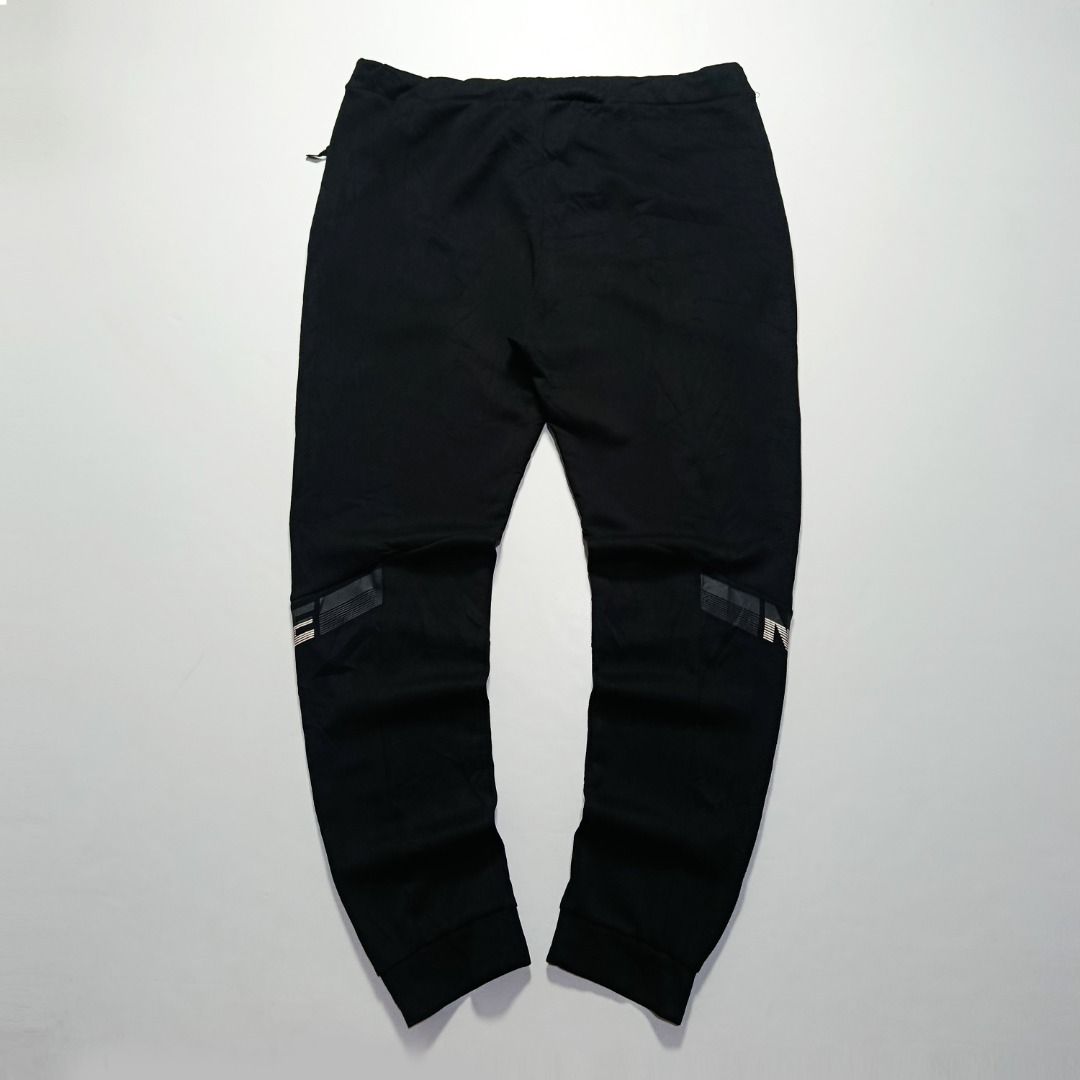 Nike Knee Graphic Black Jogger Pants (Category: Joggers) located in Taytay. Submitted by hoodgrail.vtg (Listing ID 1468621528, Image 2). Description: • Excellent condition - Like new • Contrasting Nike knee graphics, embroidered Swoosh logo, adjustable drawstring waist and tapered cuffs • Size on tag: 4XL — best fits 34–38 • Measurements: 18.5 x 41.5 in • Leg opening: 5.5 in (elastic) • Color rate: 9.5/10 • Issue: None.