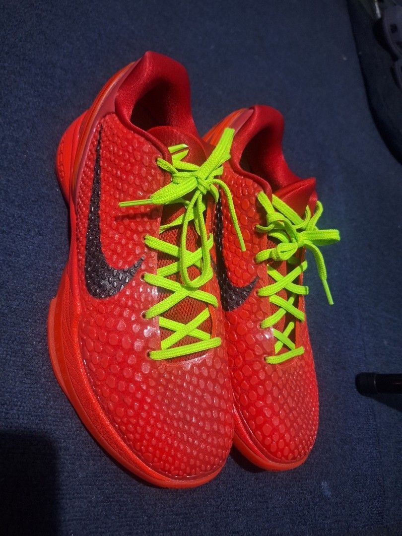 Nike Kobe 6 Protro Reverse grinch size 10.5 GK batch (Category: Sneakers) located in Manila. Submitted by adolphreyes645 (Listing ID 1468558227, Image 3). Description: - Model: Nike Kobe 6 Protro basketball shoes - Colorway: Bright red upper with striking neon green laces - Design: Iconic textured scaly finish with a dark side swoosh - Comfort & Performance: Built-in Zoom cushioning technology - Extras: Custom insoles featuring text graphics - Co