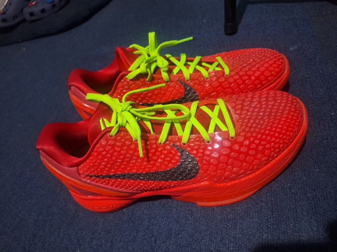 Nike Kobe 6 Protro Reverse grinch size 10.5 GK batch (Category: Sneakers) located in Manila. Submitted by adolphreyes645 (Listing ID 1468558227, Image 1). Description: - Model: Nike Kobe 6 Protro basketball shoes - Colorway: Bright red upper with striking neon green laces - Design: Iconic textured scaly finish with a dark side swoosh - Comfort & Performance: Built-in Zoom cushioning technology - Extras: Custom insoles featuring text graphics - Co