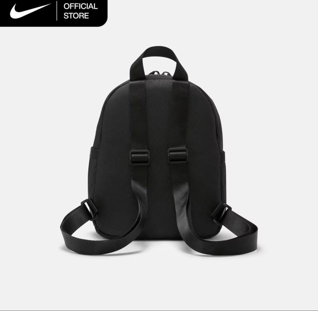 Nike Mini Backpack Black White (Category: Backpacks) located in Marikina City. Submitted by ellies.mnl (Listing ID 1468522526, Image 3). Description: - Color: Classic black with a striking white Nike swoosh logo - Compact & Lightweight: Perfect for everyday use and carrying essentials - Storage: Main compartment with a convenient internal mesh pocket and a front zipper pocket - Comfort & Portability: Features adjustable black shoulder straps and 