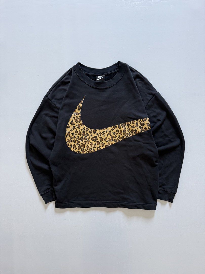 NIKE NSW LEOPARD BIG SWOOSH (Category: Coats, Jackets and Outerwear) located in Cavite. Submitted by chooseyouroutfit (Listing ID 1468508587, Image 1). Description: NIKE NSW LEOPARD BIG SWOOSH Big swoosh hanggang sa likod Length - 24 Width - 23 No issue Check detailed pictures .