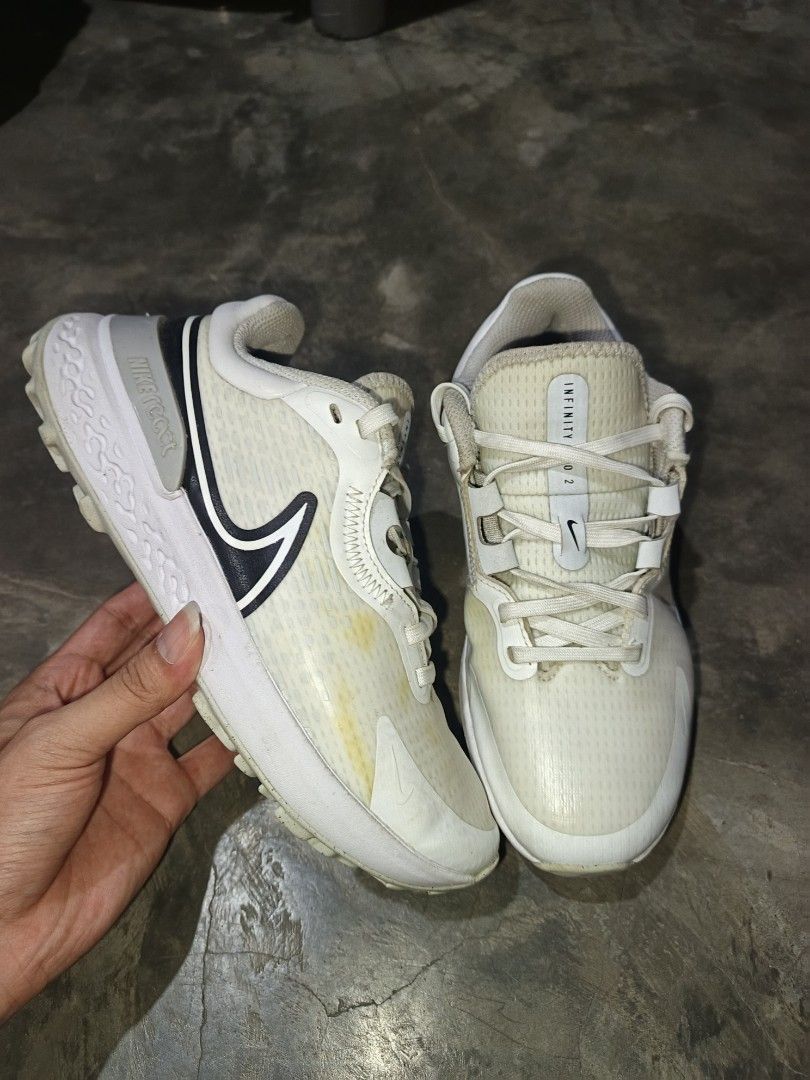 Nike React Infinity Pro 2 Golf Shoes White Black (Category: Sneakers) located in Davao. Submitted by judethrifter (Listing ID 1468670368, Image 2). Description: - Brand/Model: Nike React Infinity Pro 2 Golf Shoes - Color: White and Black - Closure: Lace-up - Cushioning: Nike React technology for all-day comfort - Traction: High-grip tread on soles for stability on the course - Condition: Good performance, with some visible yellow stains on the up