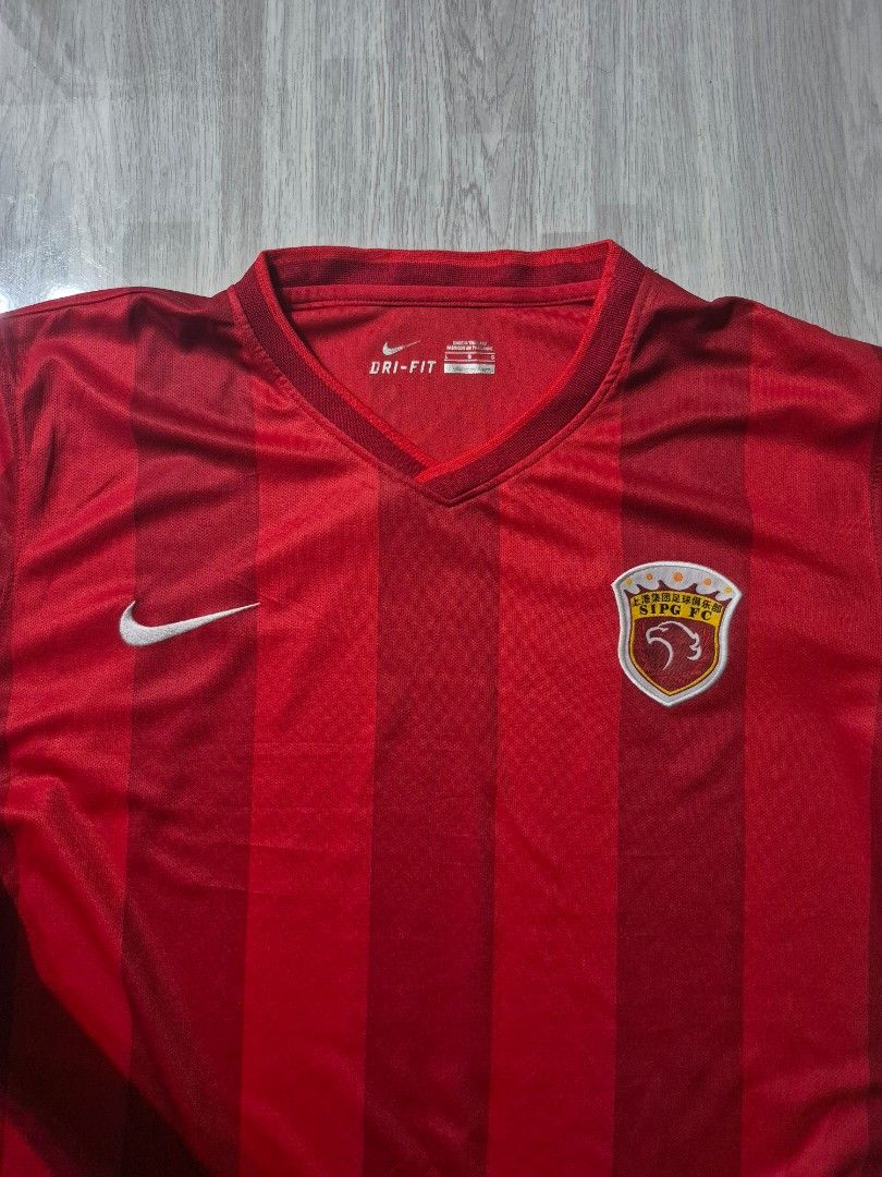 Nike Soccer Jersey (Category: Tshirts & Polo Shirts ) located in Taguig. Submitted by kai.exe (Listing ID 1468582961, Image 3). Description: Nike Shanghai Soccer jersey Drifit Crimson Red colorway Size Large 23x28 excellent condition no issues open for nego.