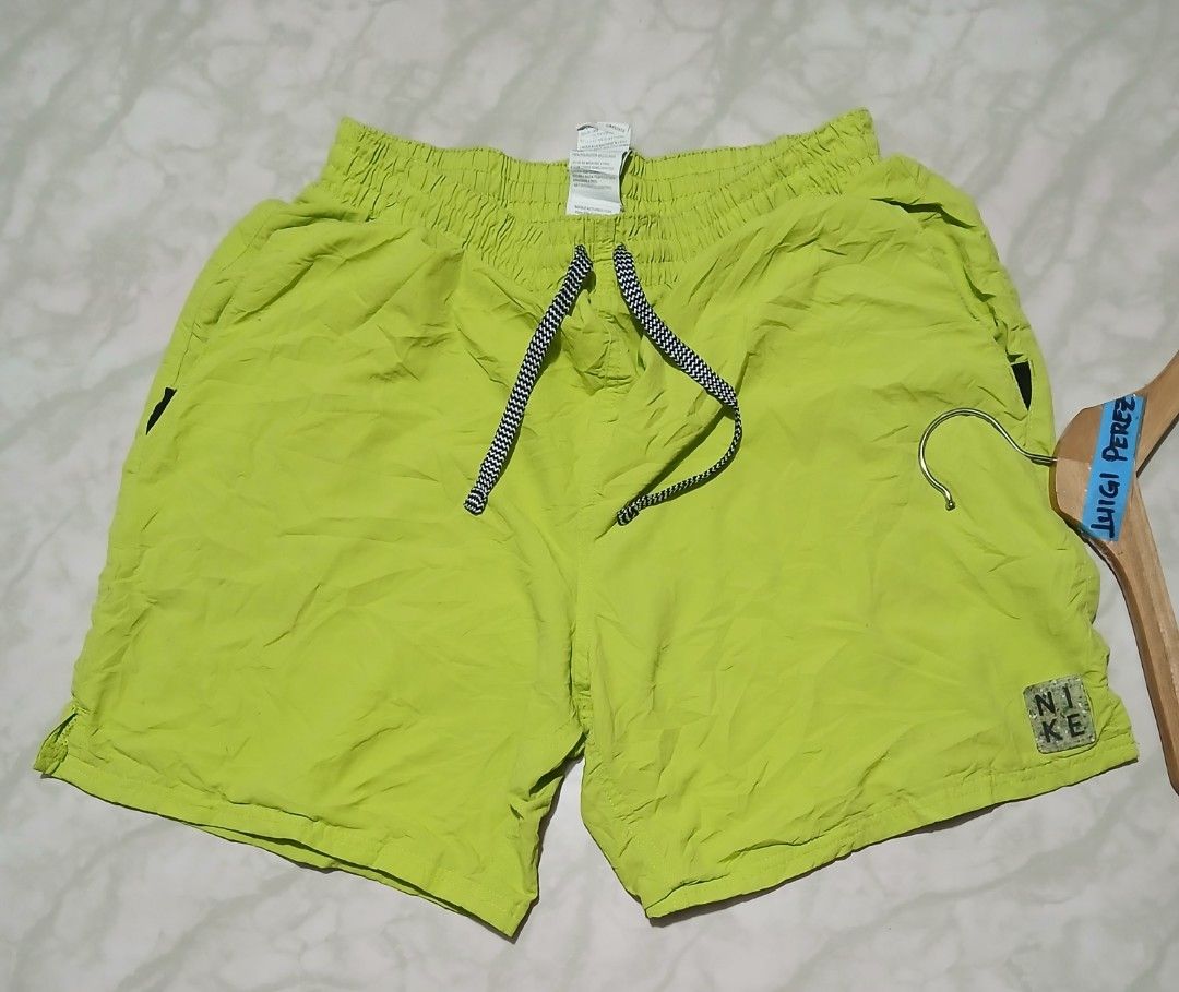 Nike Solid Icon 5" Volley Swim Shorts Green Medium (Category: Swim Trunks & Board Shorts) located in Plaridel. Submitted by igieperez147282 (Listing ID 1468659864, Image 3). Description: - Brand: Nike - Item: Volley Swim Shorts - Color: Bright Lime Green - Size: Medium (Waist fits approx. 28"-34", Length: 16") - Material: 100% Polyester (Made in Indonesia) - Features: Elastic waist, adjustable patterned drawstring, built-in mesh lining, and small