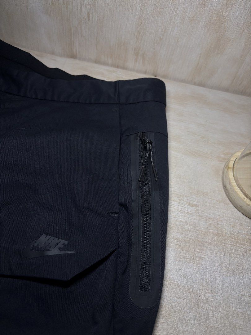 NIKE SPORTSWEAR TECH PACK PANTS (Category: Trousers) located in Cabuyao City. Submitted by pormanation-thrift-store (Listing ID 1468601057, Image 3). Description: NIKE SPORTSWEAR TECH PACK PANTS Condition: LIKE NEW Color rate: 10/10 (PWEDE SA MASELAN) Size: 34 Dimes: 34”Wx37.5”L Issue: NONE‼️ Price: 1800.