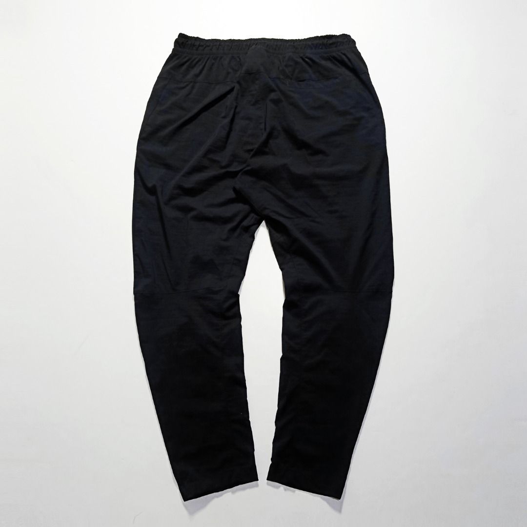 Nike Tech Street Black Trousers Embossed Logo (Category: Joggers) located in Taytay. Submitted by hoodgrail.vtg (Listing ID 1468608220, Image 2). Description: • Excellent condition - Like new • Lightweight nylon-stretch fabric, embossed Nike Swoosh logo, adjustable drawstring waist and zippered pockets • Size on tag: XL — best fits 32–34 • Measurements: 16 x 39 in • Leg opening: 6 in • Color rate: 9.5/10 • Issue: None.