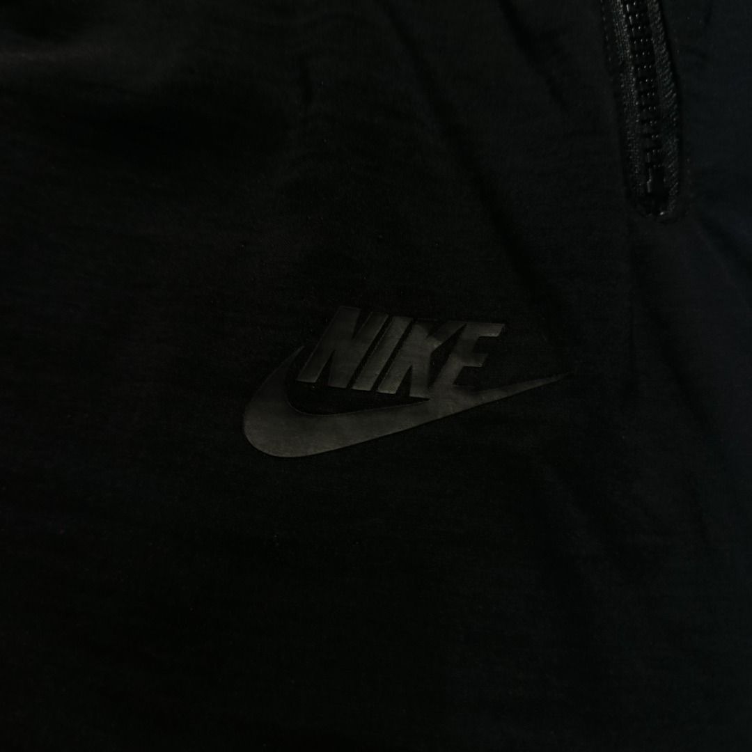 Nike Tech Street Black Trousers Embossed Logo (Category: Joggers) located in Taytay. Submitted by hoodgrail.vtg (Listing ID 1468608220, Image 3). Description: • Excellent condition - Like new • Lightweight nylon-stretch fabric, embossed Nike Swoosh logo, adjustable drawstring waist and zippered pockets • Size on tag: XL — best fits 32–34 • Measurements: 16 x 39 in • Leg opening: 6 in • Color rate: 9.5/10 • Issue: None.