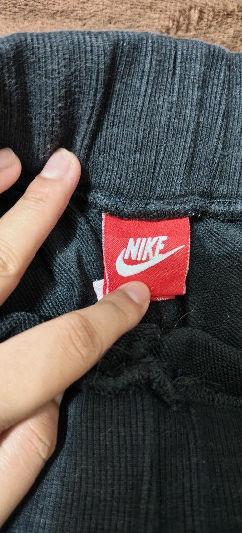 Nike Track & Field Black Sweatpants XXL (Category: Joggers) located in Manila. Submitted by snz_shop (Listing ID 1468533421, Image 3). Description: - Brand: Nike Track and Field - Size: XXL (Relaxed fit) - Color: Black with bright neon yellow logo - Waistband: Elastic with matching neon green drawstring - Pockets: Deep pockets on both sides - Material: Soft, warm inner fabric for maximum comfort - Condition/Origin: Made in China, great for workou
