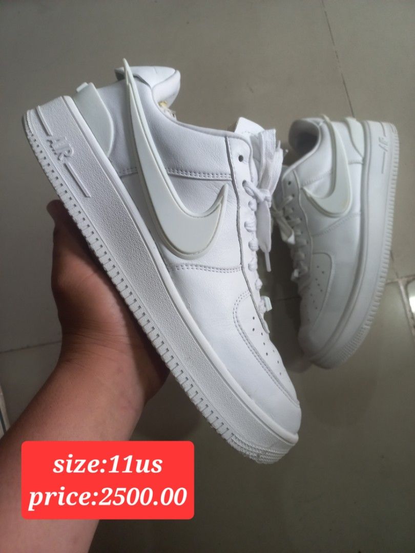 Nike x Ambush Air Force 1 Low White (Category: Sneakers) located in Kalibo. Submitted by jofit2ndhandshoes (Listing ID 1468676591, Image 1). Description: - Model: Nike Air Force 1 Low x Ambush - Colorway: Clean White - Size: 11 US - Condition: Excellent, minimal creasing on clean upper - Key Features: Distinctive chunky elongated swoosh, Ambush branding on heels, and classic AF1 metal dubraes - Comfort: Solid rubber cupsole equipped with signatur