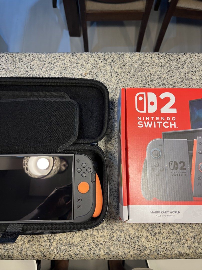Nintendo Switch 2 (Category: Nintendo) located in Silang. Submitted by souisse (Listing ID 1468650613, Image 2). Description: FOR SALE: NINTENDO SWITCH 2 🎮 with complete original accessories Bought last MAY 2026 REASON FOR SELLING: RARELY USED Games Included: * Mario Kart World * Pokemon Pokopia * Legend of Zelda Breath of the Wild Switch 2 Ed. Accessories Included and Installed: Skull and Co. Thumbgrips Skull and Co. FissionGrip Skull and Co. T