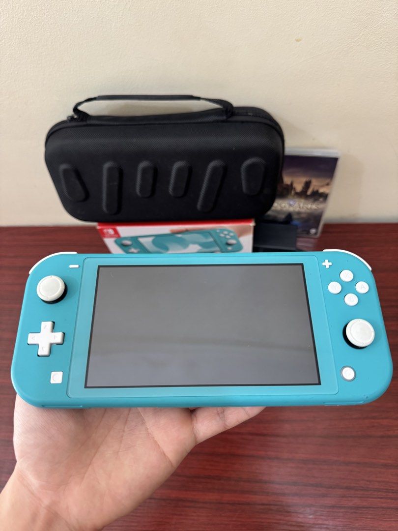 Nintendo Switch Lite (Category: Nintendo) located in Quezon City. Submitted by kevin.amolador (Listing ID 1468627430, Image 2). Description: Nintendo Switch Lite Includes: • Charger • Hogwarts Legacy • Tempered Glass (installed) • Hard Case • Box No SD card included No issues, unli testing upon meetup Selling for ₱6,000 (fixed) Meetup: SM North/Trinoma/Fishermall.