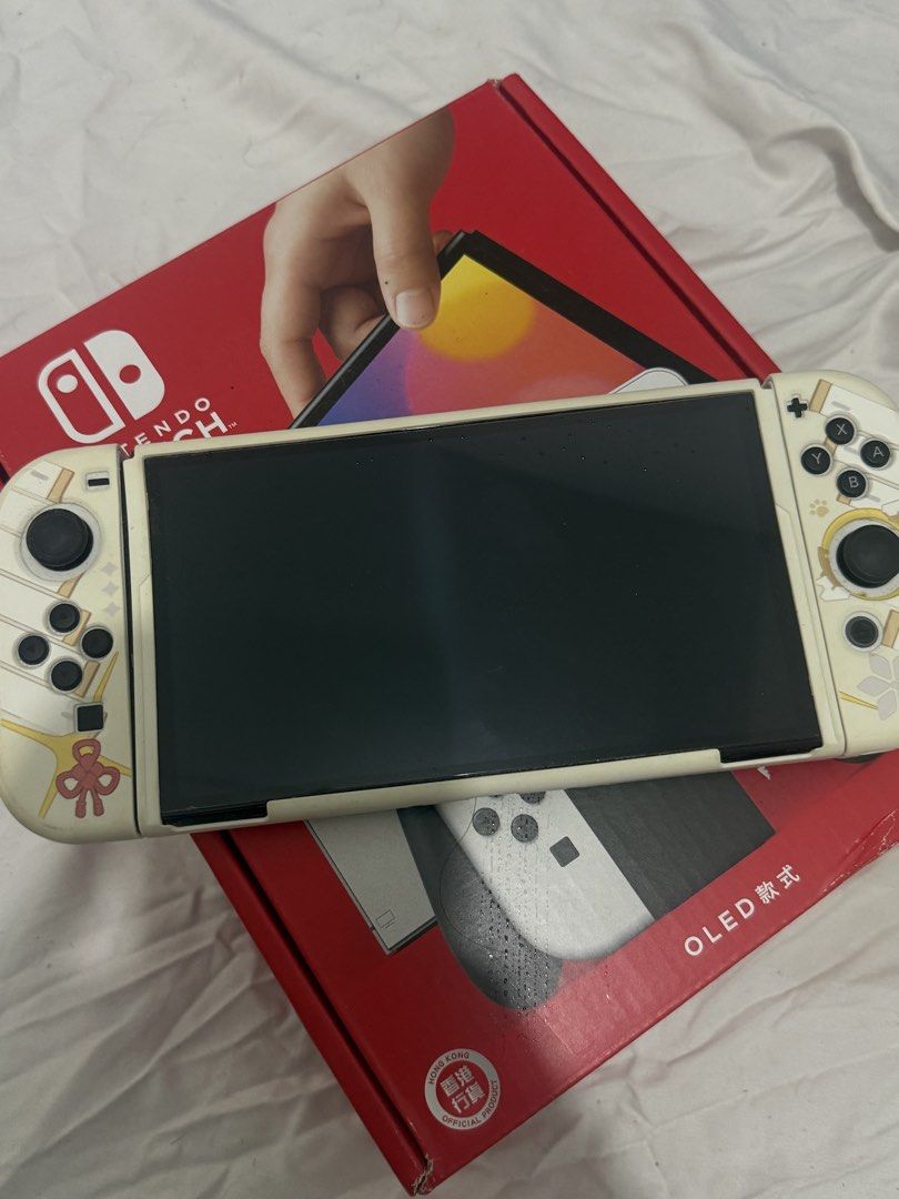 Nintendo Switch OLED Model with Custom Cover Case and Box (Category: Nintendo) located in Malolos. Submitted by relattei (Listing ID 1468550389, Image 1). Description: - Nintendo Switch OLED console - has slightly dents lang sa joystick body but barely noticeable sa liit other than that wala naman ng issue - complete inclusion - no games included .