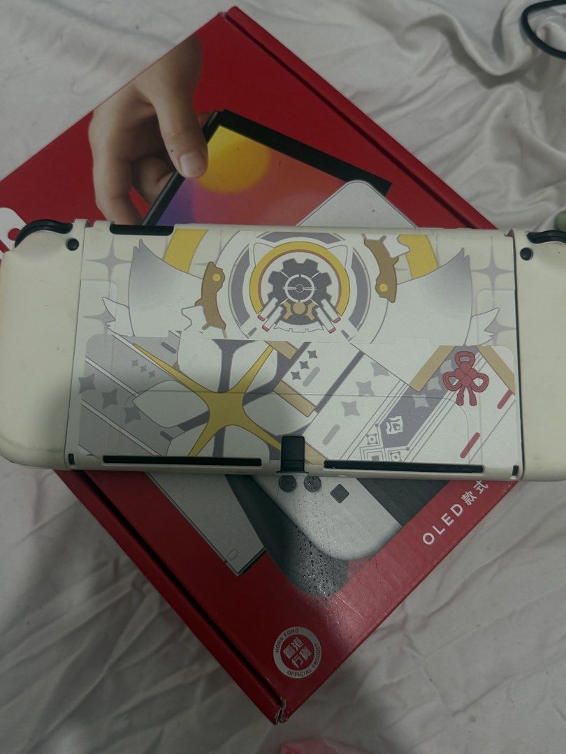 Nintendo Switch OLED Model with Custom Cover Case and Box (Category: Nintendo) located in Malolos. Submitted by relattei (Listing ID 1468550389, Image 2). Description: - Nintendo Switch OLED console - has slightly dents lang sa joystick body but barely noticeable sa liit other than that wala naman ng issue - complete inclusion - no games included .